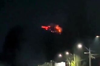 Stunned woman captures mysterious red 'UFO' hovering in Chile's night sky, sparking a viral sensation and social media buzz with theories and reactions.