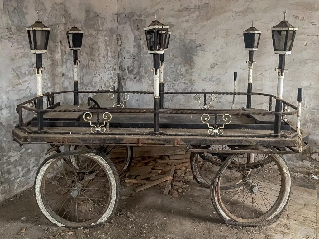 British explorer Chloe Urbex uncovers a spooky, abandoned morgue in Belgium, complete with a Victorian-era hearse and autopsy table, thrilling fans with her eerie find.