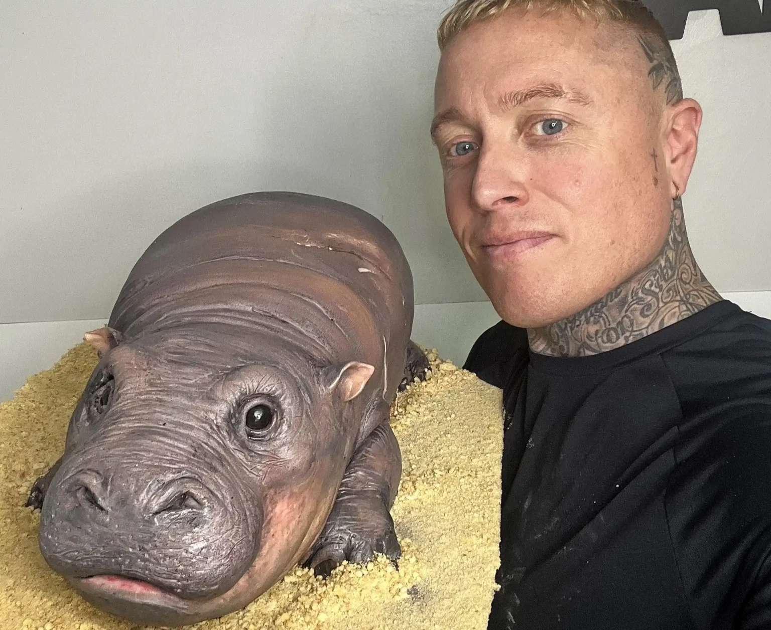 Baker Ben Cullen wows social media with a hyper-realistic cake of viral pygmy hippo Moo Deng. The adorable tribute has gained millions of views and thousands of reactions.