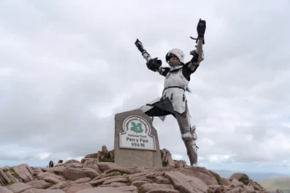 Britain's top female knight, Emma Pearn, scales 3,000ft mountain in full 15th-century armour, raising awareness for The Royal Armouries and women in jousting.