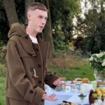 Chelsea star Cole Palmer is teased for resembling Rodney Trotter in a Burberry ad, where fans liken his duffle coat to the iconic sitcom character’s style.