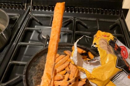 Couple celebrating their wedding anniversary discovers a 9-inch frozen chip while preparing dinner, adding a fun twist to their romantic meal. A true dinner surprise!