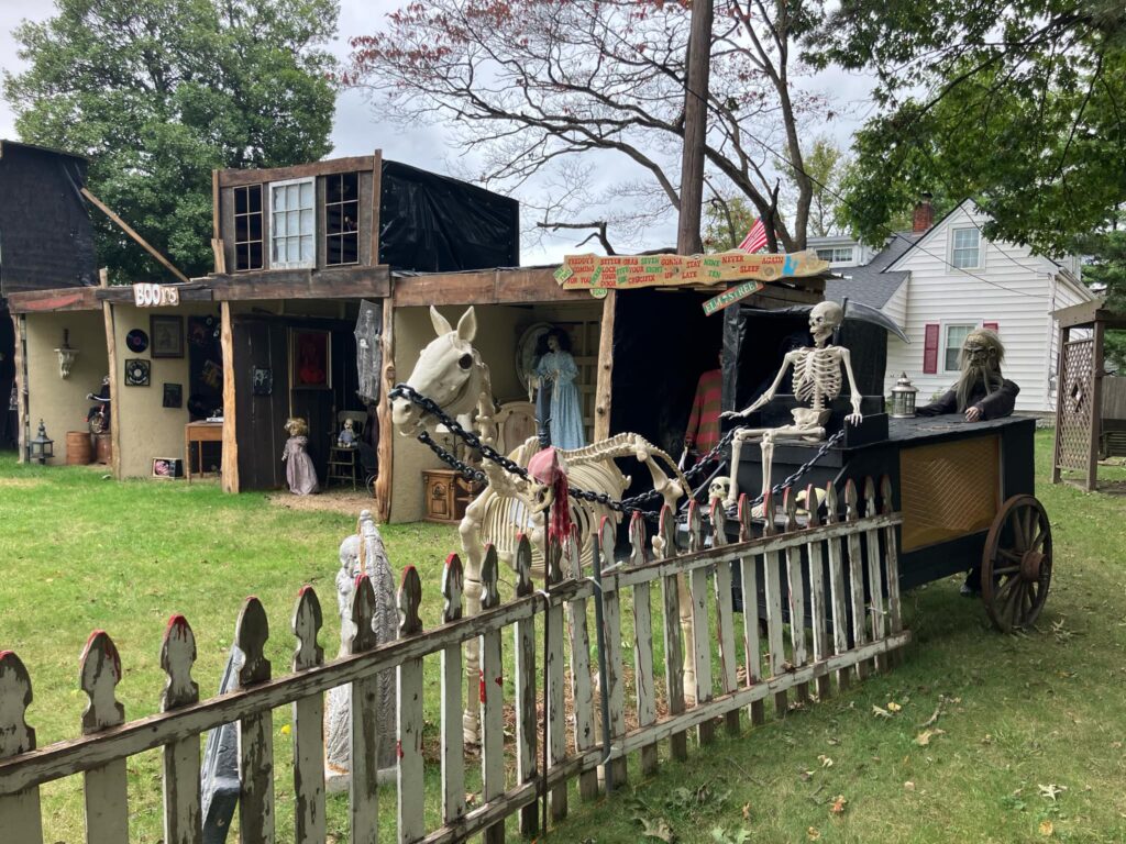 Ohio father-daughter duo spend £13,000 creating an epic Halloween ‘House of Horrors’ for charity, featuring themed rooms, animatronics, and a haunted DJ booth.