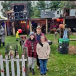 Ohio father-daughter duo spend £13,000 creating an epic Halloween ‘House of Horrors’ for charity, featuring themed rooms, animatronics, and a haunted DJ booth.