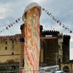 A controversial 39ft phallic monument in Naples' Piazza Municipio sparks outrage and debate, as locals react to late artist Gaetano Pesce's final tribute to his home city.