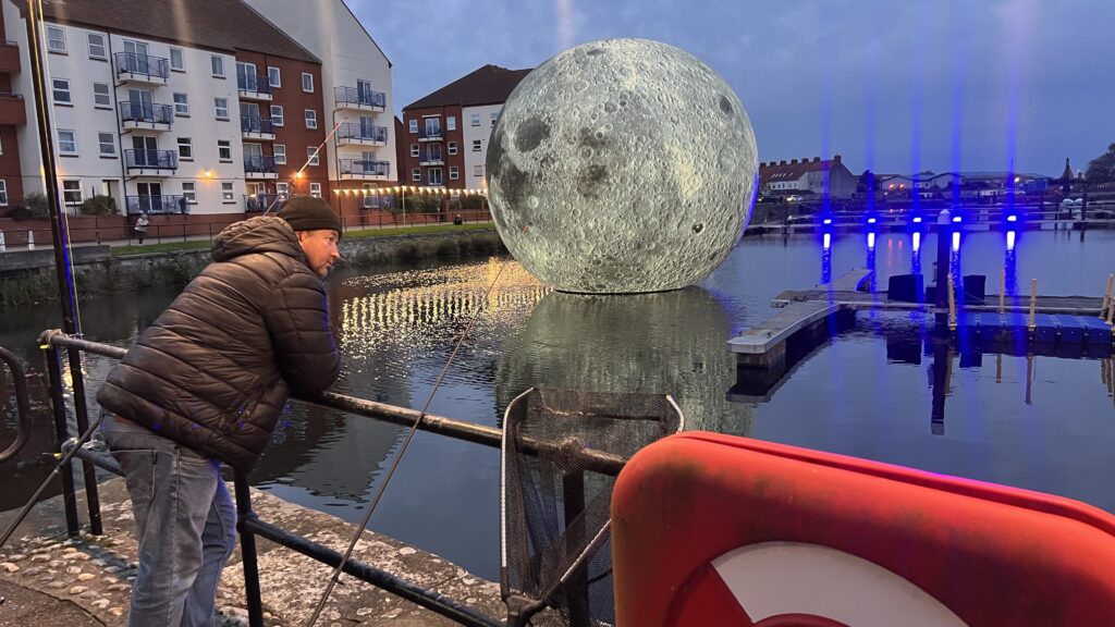 Luke Jerram's 30ft inflatable moon deflates twice due to storm damage in Somerset, cutting short the popular outdoor installation that had attracted over 10,000 visitors.