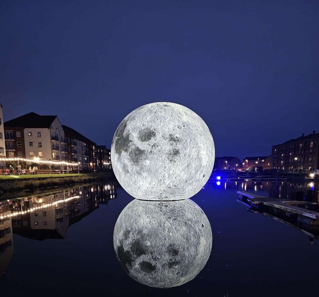 Luke Jerram's 30ft inflatable moon deflates twice due to storm damage in Somerset, cutting short the popular outdoor installation that had attracted over 10,000 visitors.