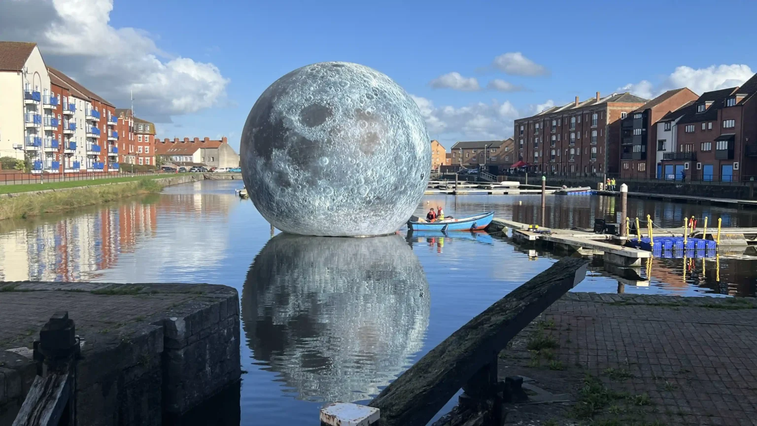 Luke Jerram's 30ft inflatable moon deflates twice due to storm damage in Somerset, cutting short the popular outdoor installation that had attracted over 10,000 visitors.