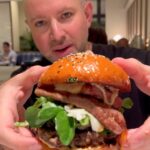 A foodie slammed Gordon Ramsay's £85 burger at Harrods, calling it overpriced and difficult to chew. Despite its luxury ingredients, he left unimpressed.