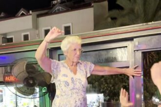 An elderly woman dancing on a bar table has gone viral, racking up 45 million views as she joyfully shimmies to a remix in Marmaris, Turkey, proving age is just a number.