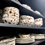 H&M's new Speckled-Glaze crockery range, featuring a brown speckled pattern, has been ridiculed by shoppers for resembling poo. Despite the jokes, some find the design cute.