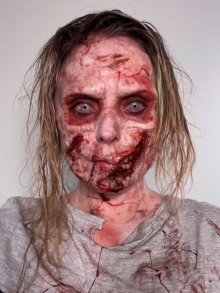 Horror-loving makeup artist Roligore stuns followers with intricate, terrifying transformations, from Beetlejuice zombies to monstrous creatures, showcasing her SFX skills.