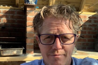 Builder Nigel Lambert, 50, constantly mistaken for Hugh Grant, gets stopped for selfies daily. The lookalike says he's flattered by the attention, much to his wife's delight.