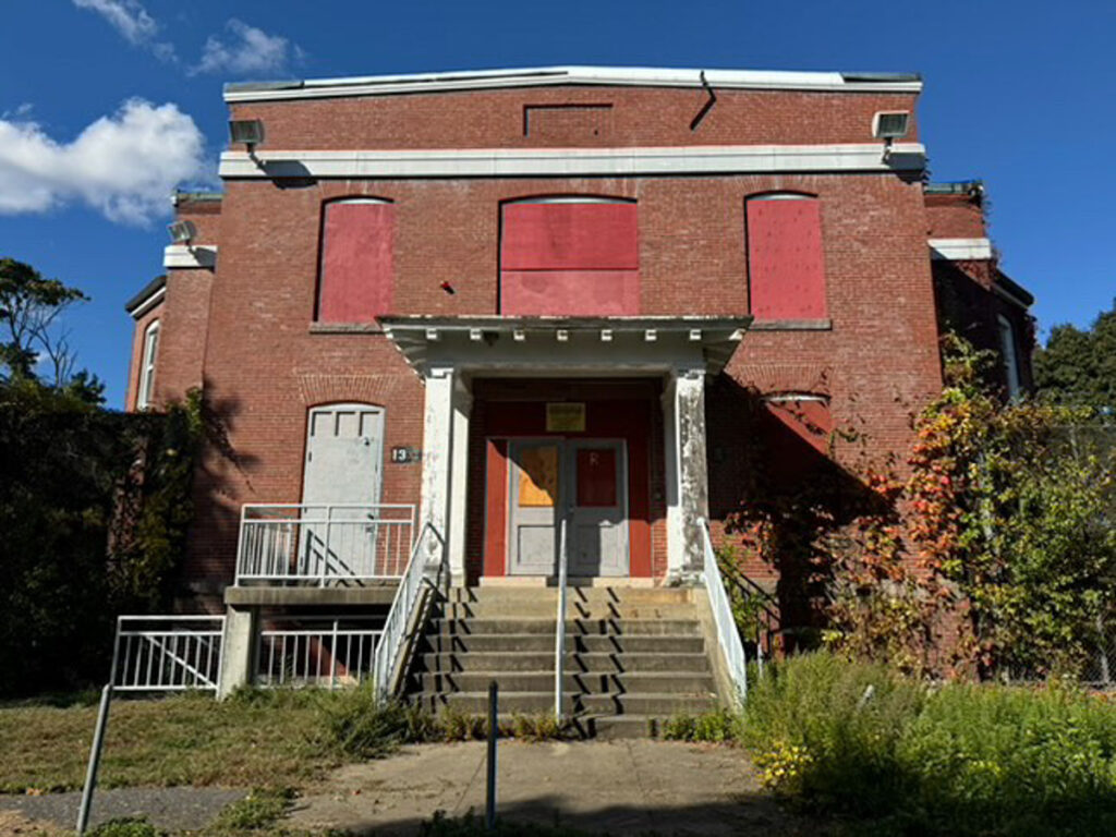 Explore eerie photos of Medfield State Hospital, the abandoned asylum turned film set for movies like Shutter Island, now open to public for a chilling look inside.