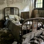 Explore eerie photos of Medfield State Hospital, the abandoned asylum turned film set for movies like Shutter Island, now open to public for a chilling look inside.