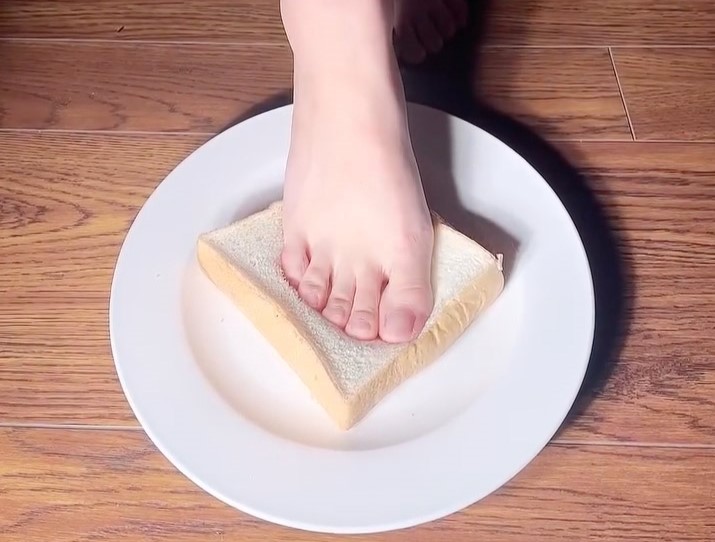 Instagram model Silverluri Luo launches quirky 'foot toast' venture, selling bread imprinted with her feet for £20 a slice. Fans can keep it as a souvenir or eat it!