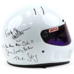 A helmet signed by Jeremy Clarkson with "F*ck off," intended for producer Oisin Tymon after their 2015 altercation, sold for £3,800 at auction, exceeding expectations.