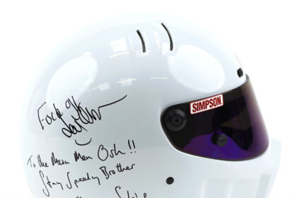 A helmet signed by Jeremy Clarkson with "F*ck off," intended for producer Oisin Tymon after their 2015 altercation, sold for £3,800 at auction, exceeding expectations.