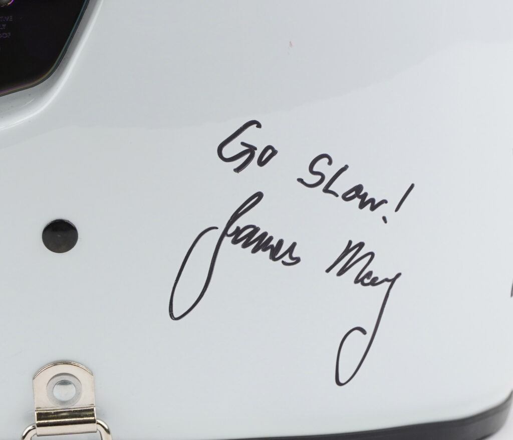 A helmet signed by Jeremy Clarkson with "F*ck off," intended for producer Oisin Tymon after their 2015 altercation, sold for £3,800 at auction, exceeding expectations.