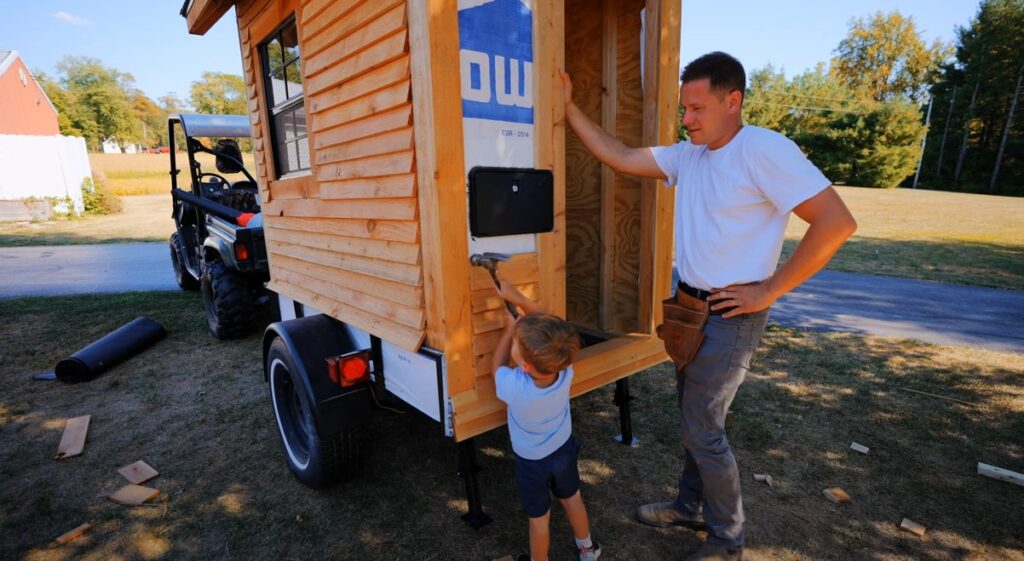 A man has built the ‘world's smallest tiny home,’ measuring just 19.46 sq ft, complete with a bed, kitchen, shower, and toilet, aiming to break a Guinness World Record.