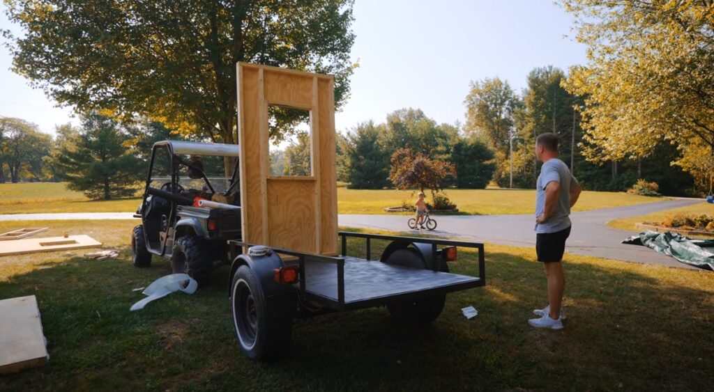 A man has built the ‘world's smallest tiny home,’ measuring just 19.46 sq ft, complete with a bed, kitchen, shower, and toilet, aiming to break a Guinness World Record.