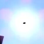 UFO spotted hovering above petrol station in Cuernavaca, Mexico, sparking debate as locals film mysterious craft silhouetted by the sun.