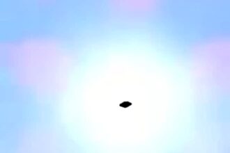 UFO spotted hovering above petrol station in Cuernavaca, Mexico, sparking debate as locals film mysterious craft silhouetted by the sun.