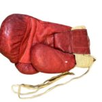 Muhammad Ali's iconic 1963 boxing glove, worn during his legendary fight with Henry Cooper, is set to sell for up to £6 million in an auction ending October 31.