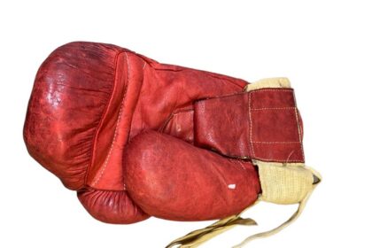 Muhammad Ali's iconic 1963 boxing glove, worn during his legendary fight with Henry Cooper, is set to sell for up to £6 million in an auction ending October 31.