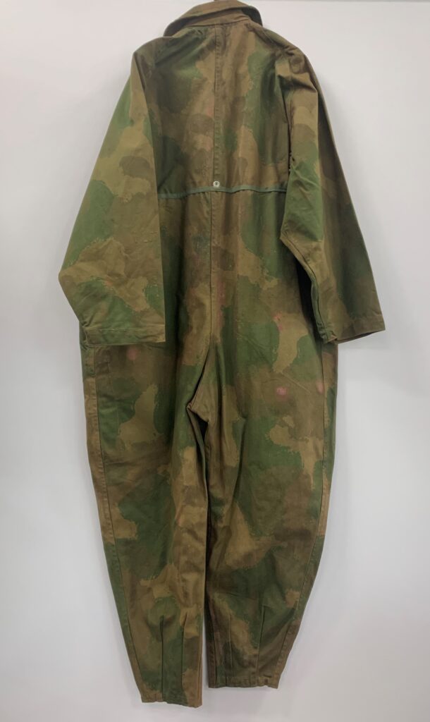 Rare WWII British SOE camouflage suit, designed for secret agents behind enemy lines, up for auction. Unique artifact includes quick-disposal features and hidden pockets.