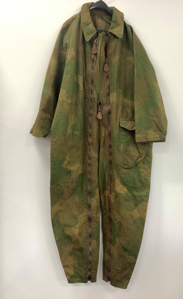 Rare WWII British SOE camouflage suit, designed for secret agents behind enemy lines, up for auction. Unique artifact includes quick-disposal features and hidden pockets.