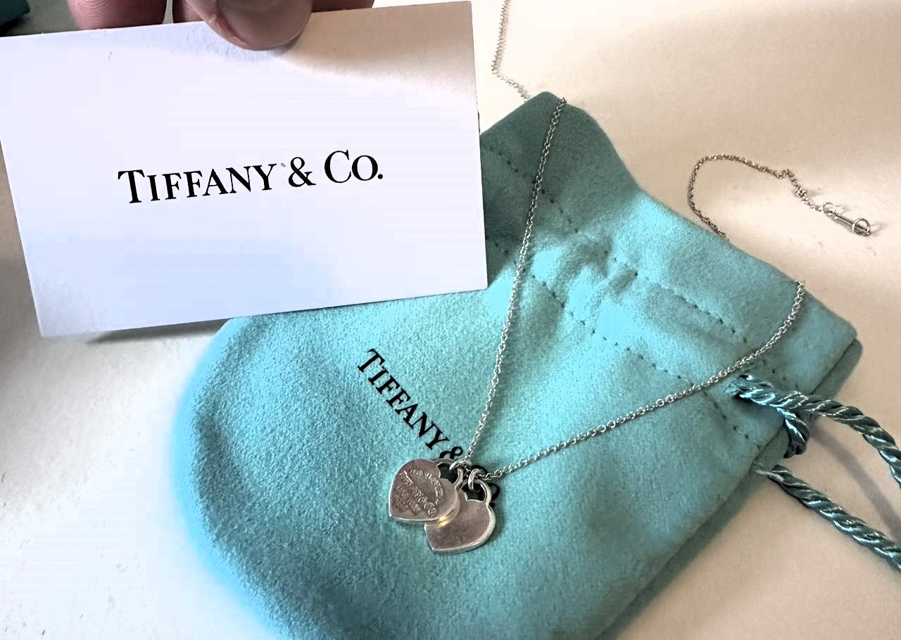 Woman takes revenge on cheating ex by selling his £275 Tiffany necklace for just £100, complete with a brutally honest description.