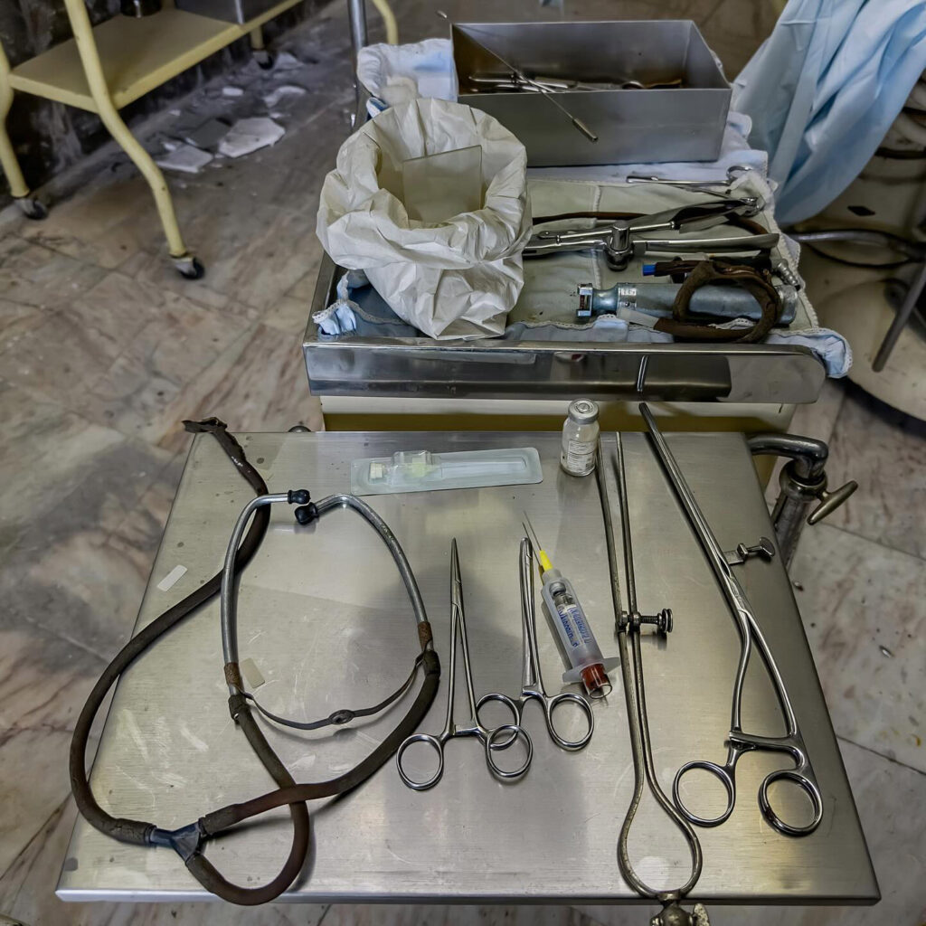 Urban explorer discovers abandoned Portuguese hospital untouched for 20+ years, filled with rusting medical equipment and eerie decay - like stepping into a horror set!