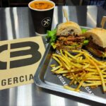 Burgerciaga, a Balenciaga-inspired burger joint in Taipei, wows diners with chic design and affordable prices, offering gourmet burgers under £15 in a luxury setting.