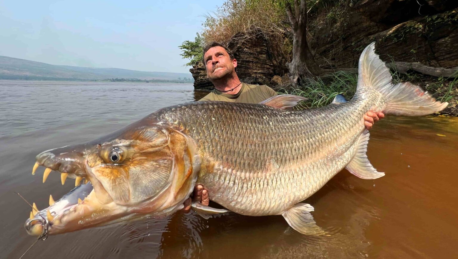 British fisherman David Watmough shares thrilling tales of catching river monsters worldwide, from Goliath Tiger Fish to 220lb catfish, facing extreme risks along the way.