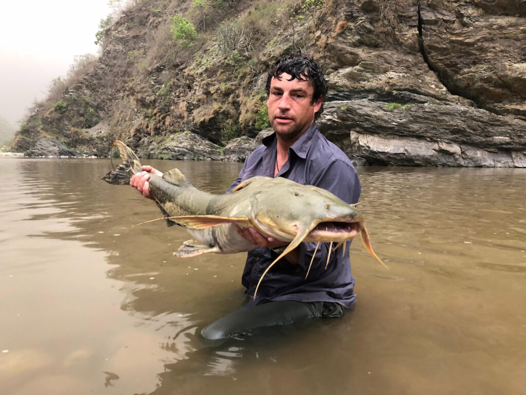 British fisherman David Watmough shares thrilling tales of catching river monsters worldwide, from Goliath Tiger Fish to 220lb catfish, facing extreme risks along the way.