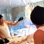 Builders smash luxury bathroom after client allegedly fails to pay $10,000 labor fee. Viral TikTok video sparks debate on handling payment disputes. 920,000+ views.