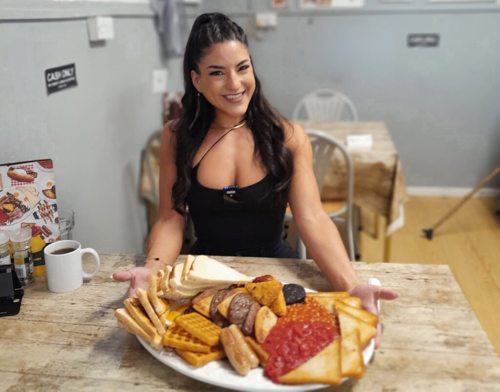 Competitive eater Leah Shutkever demolishes 12 giant doughnuts in record time, completing Dirty Dozen Challenge in just 13 minutes and winning rave reviews for the treat.