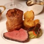 Gordon Ramsay's £55 roast dinner at the Savoy Grill sparks backlash for its small portion size. Diners call it a "kids' portion," while some praise its presentation.