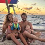 A family living on a sailboat shares how their minimalist Christmas focuses on traditions, memories, and unique adventures, from toy cars to festive meals at sea.