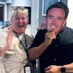 Holiday Inn staff in Bolton don Alan Halsall masks to cheer on the I'm A Celeb star, best known as Tyrone Dobbs in Corrie. Fans and locals rally behind him!