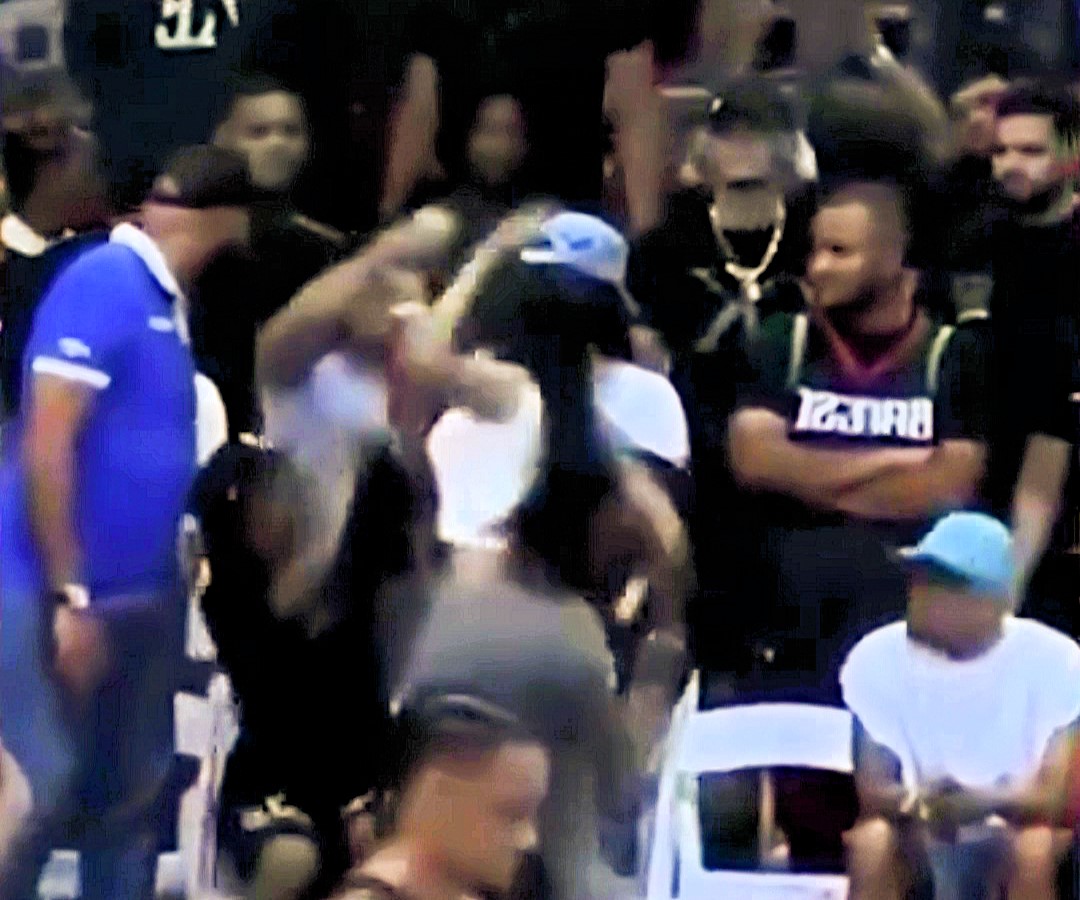 Influencer Yailin’s courtside brawl at Dominican basketball game goes viral; heated exchange halts game as bystanders intervene, leaving fans speculating on the cause.