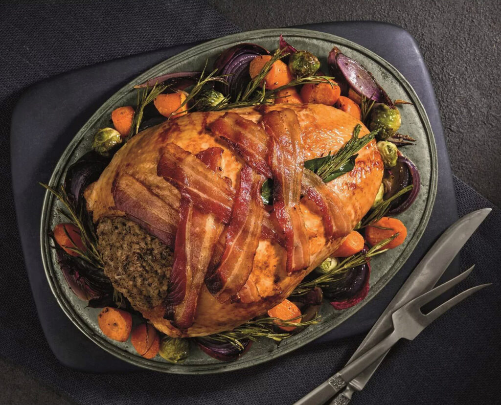 UK Christmas turkeys soar in price, with premium butcher offering a £275 herb-fed bird. High-end supermarkets follow suit, marking a pricey festive season amid inflation.