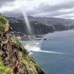 Gigantic waterspout captured near Madeira stuns viewers; the rare weather phenomenon dissipates near land, showcasing nature's awe-inspiring yet dangerous power.