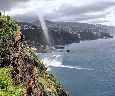 Gigantic waterspout captured near Madeira stuns viewers; the rare weather phenomenon dissipates near land, showcasing nature's awe-inspiring yet dangerous power.