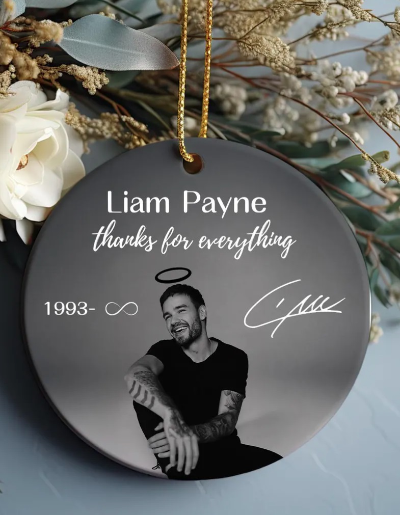 Fans honor late One Direction star Liam Payne with memorial Christmas baubles, featuring angel wings and heartfelt tributes, as they remember the singer this holiday season.