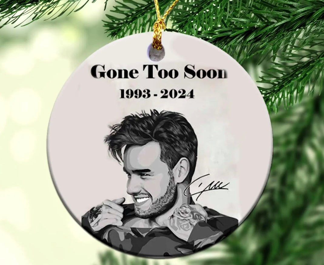 Fans honor late One Direction star Liam Payne with memorial Christmas baubles, featuring angel wings and heartfelt tributes, as they remember the singer this holiday season.