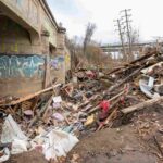 A videographer captures the devastating aftermath of Hurricane Helene in Florida, two months on. Homes destroyed, debris piled high, and messages of resilience remain.