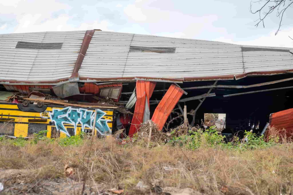 A videographer captures the devastating aftermath of Hurricane Helene in Florida, two months on. Homes destroyed, debris piled high, and messages of resilience remain.