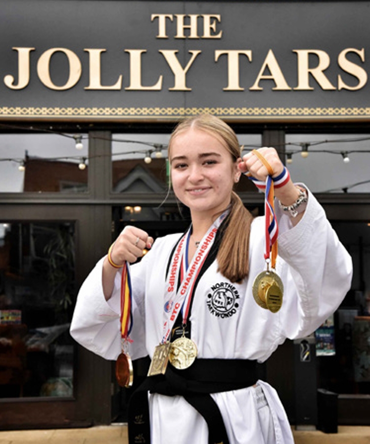 Teen Wetherspoons waitress and 4th dan black belt, Ella Heyes, balances work, A Levels, and taekwondo, earning gold at the British Championships and bronze in Europe.